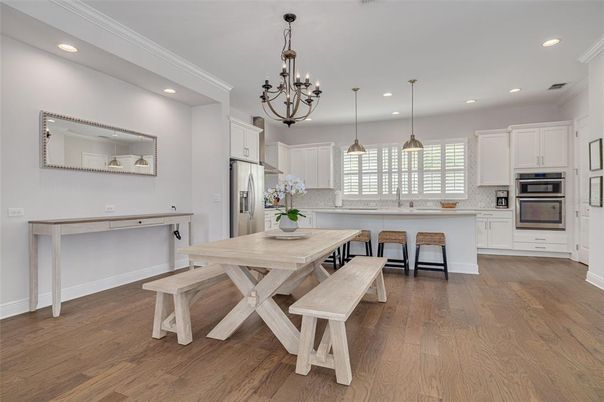Chandelier, Dining room, Interior, Kitchen, Pendant Lights, Recessed Lighting, Stainless Steel Appliances, Wood Texture Flooring
