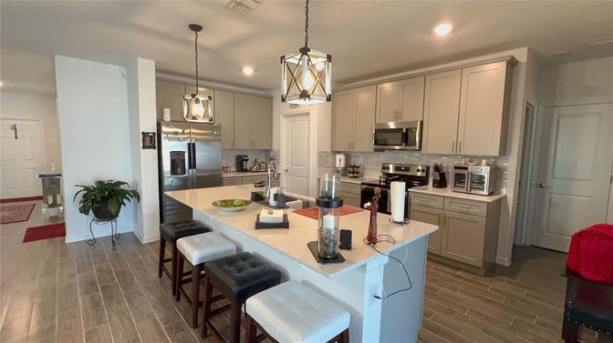 Interior, Kitchen, Pendant Lights, Recessed Lighting, Stainless Steel Appliances, Wood Texture Flooring