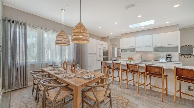 Dining room, Interior, Kitchen, Pendant Lights, Recessed Lighting, Stainless Steel Appliances, Wood Texture Flooring
