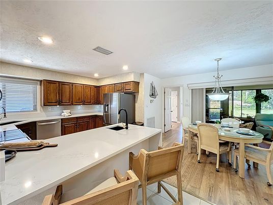 Dining room, Interior, Kitchen, Pendant Lights, Recessed Lighting, Stainless Steel Appliances, Wood Texture Flooring