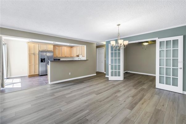 Chandelier, Empty room, Interior, Kitchen, Stainless Steel Appliances, Wood Texture Flooring