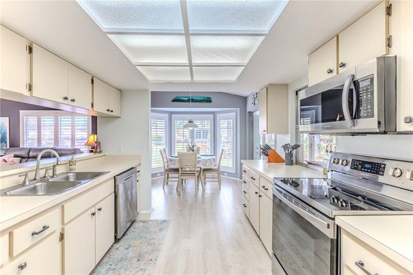 Dining room, Interior, Kitchen, Pendant Lights, Stainless Steel Appliances, Wood Texture Flooring