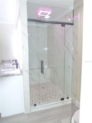 Bathroom, Glass Shower, Interior, Marble Walls, Wood Texture Flooring