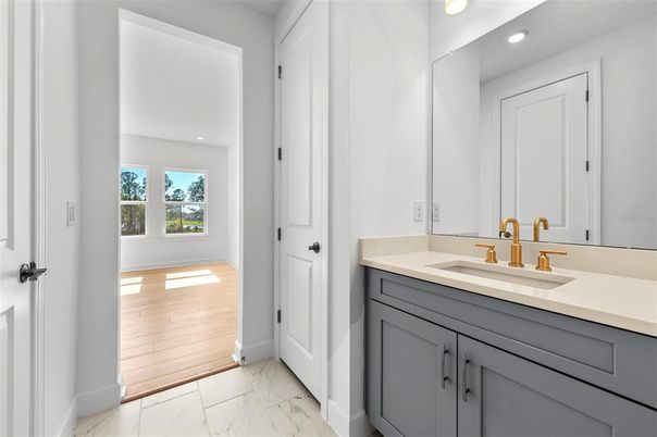 Bathroom, Dual Sink Vanities, Interior, Marble, Recessed Lighting, Wood Texture Flooring