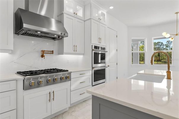 Interior, Kitchen, Marble Walls, Pendant Lights, Recessed Lighting, Stainless Steel Appliances