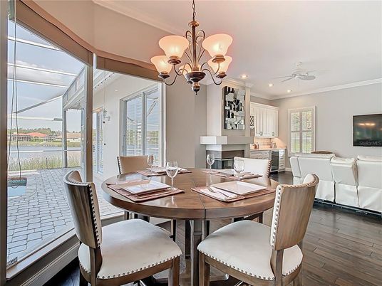 Chandelier, Dining room, Fireplace, Interior, Living room, Recessed Lighting, Wood Texture Flooring