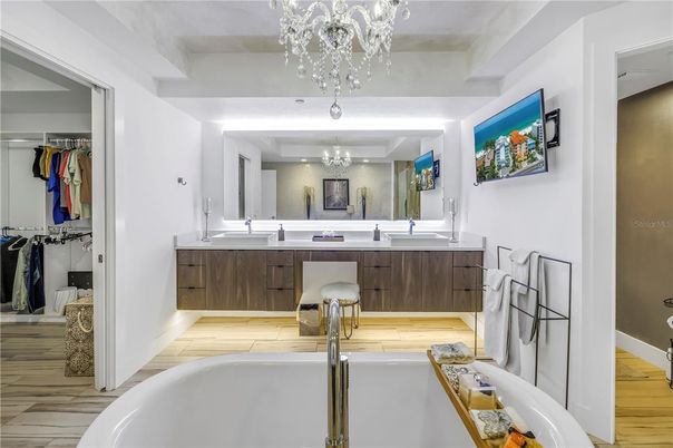 Bathroom, Chandelier, Dual Sink Vanities, Interior, Wood Texture Flooring