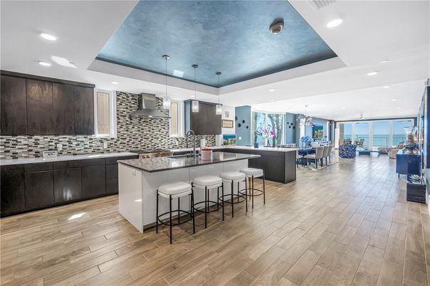 Chandelier, Dining room, Interior, Kitchen, Pendant Lights, Recessed Lighting, Stainless Steel Appliances, Water, Wood Texture Flooring