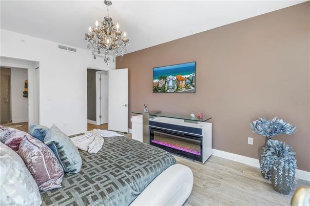 Bedroom, Chandelier, Fireplace, Interior, Wood Texture Flooring