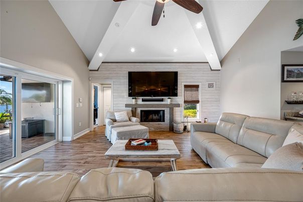 Fireplace, Interior, Living room, Recessed Lighting, Stone Walls, Wood Texture Flooring
