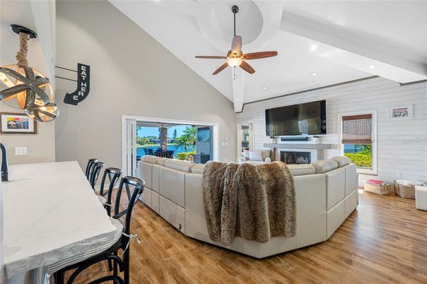 Dining room, Fireplace, Interior, Living room, Pendant Lights, Recessed Lighting, Stone Walls, Wood Texture Flooring