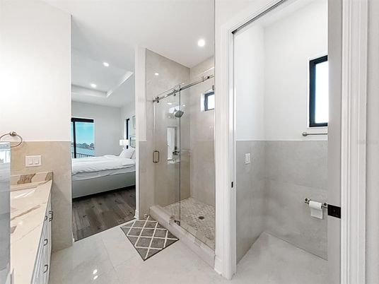 Bathroom, Bedroom, Glass Shower, Interior, Recessed Lighting, Wood Texture Flooring