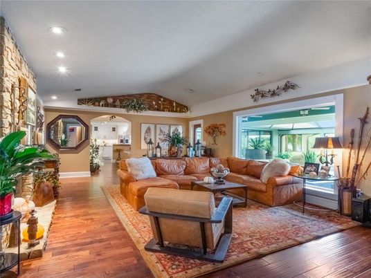 Fireplace, Interior, Living room, Recessed Lighting, Stone Walls, Wood Texture Flooring