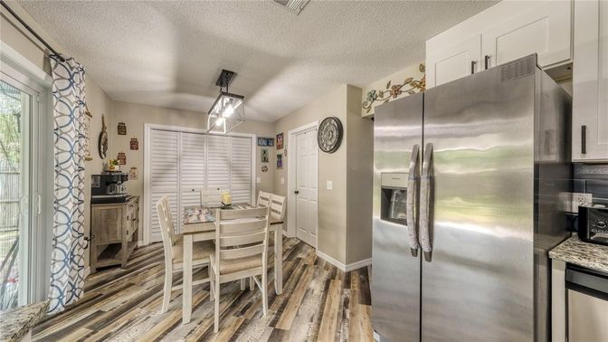 Dining room, Interior, Kitchen, Pendant Lights, Stainless Steel Appliances, Wood Texture Flooring