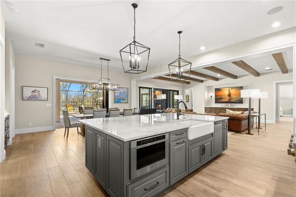 Chandelier, Dining room, Interior, Kitchen, Living room, Pendant Lights, Recessed Lighting, Wooden Beams, Wood Texture Flooring