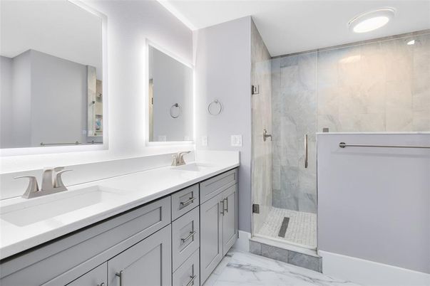 Bathroom, Dual Sink Vanities, Glass Shower, Interior, Marble, Marble Walls, Recessed Lighting
