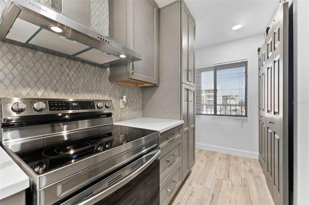 Interior, Kitchen, Recessed Lighting, Stainless Steel Appliances, Wood Texture Flooring