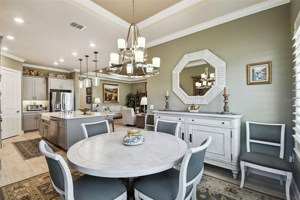Chandelier, Dining room, Interior, Kitchen, Pendant Lights, Recessed Lighting, Stainless Steel Appliances, Wood Texture Flooring