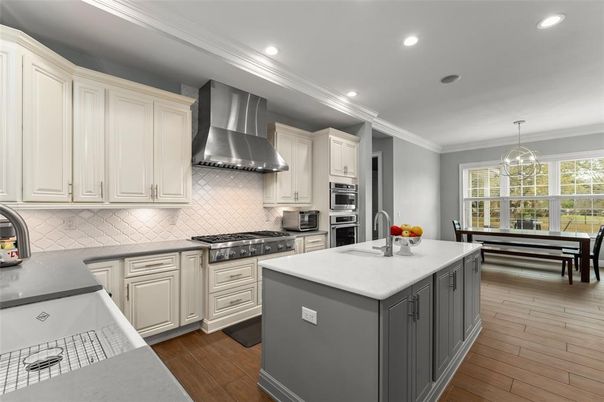 Chandelier, Dining room, Interior, Kitchen, Pendant Lights, Recessed Lighting, Stainless Steel Appliances, Wood Texture Flooring