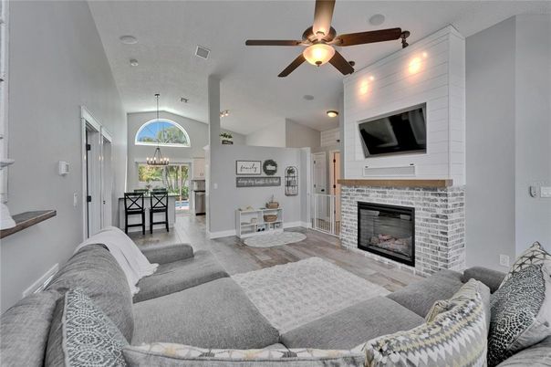 Dining room, Fireplace, Interior, Living room, Pendant Lights, Recessed Lighting, Wood Texture Flooring