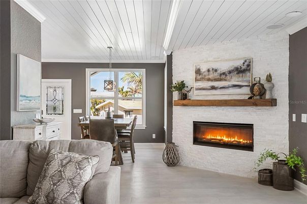 Dining room, Fireplace, Interior, Living room, Pendant Lights, Stone Walls, Wood Texture Flooring