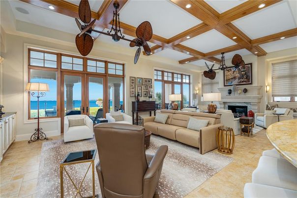 Fireplace, Interior, Living room, Piano, Recessed Lighting, Water, Wooden Beams