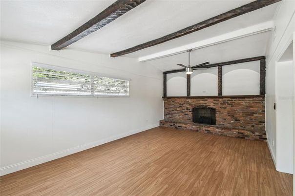 Empty room, Fireplace, Interior, Stone Walls, Wooden Beams, Wood Texture Flooring