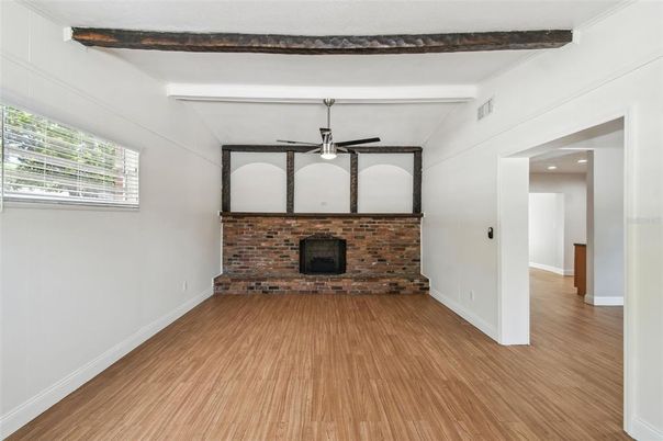 Empty room, Fireplace, Interior, Stone Walls, Wooden Beams, Wood Texture Flooring
