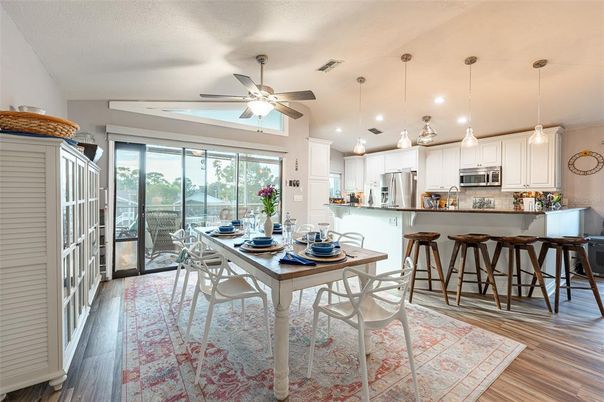 Dining room, Interior, Kitchen, Pendant Lights, Recessed Lighting, Stainless Steel Appliances, Wood Texture Flooring