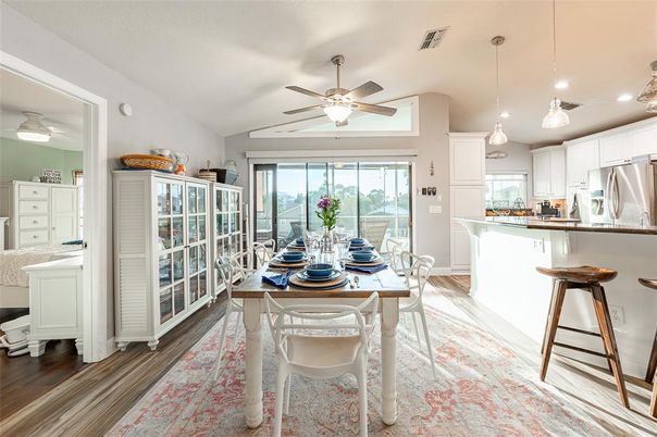 Dining room, Interior, Kitchen, Pendant Lights, Recessed Lighting, Stainless Steel Appliances, Wood Texture Flooring