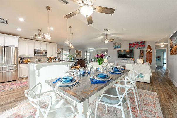 Dining room, Interior, Kitchen, Pendant Lights, Recessed Lighting, Stainless Steel Appliances, Wood Texture Flooring