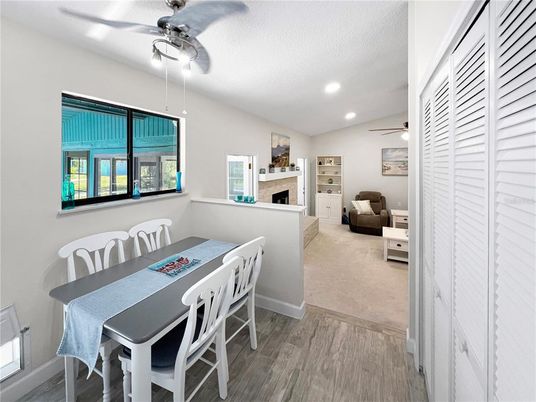 Dining room, Fireplace, Interior, Recessed Lighting, Wood Texture Flooring