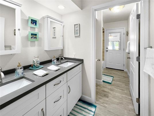 Bathroom, Dual Sink Vanities, Interior, Recessed Lighting, Wood Texture Flooring