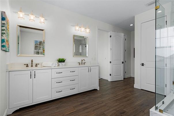 Bathroom, Dual Sink Vanities, Glass Shower, Interior, Recessed Lighting, Wood Texture Flooring