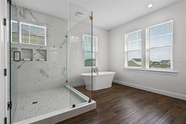 Bathroom, Free Standing Baths, Glass Shower, Interior, Marble Walls, Recessed Lighting, Wood Texture Flooring