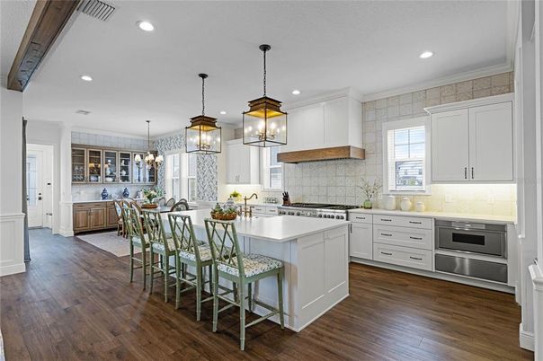 Dining room, Interior, Kitchen, Pendant Lights, Recessed Lighting, Stainless Steel Appliances, Wood Texture Flooring
