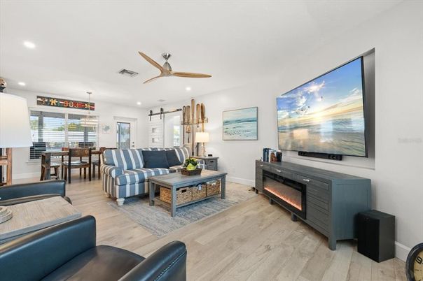 Dining room, Fireplace, Interior, Living room, Pendant Lights, Recessed Lighting, Wood Texture Flooring