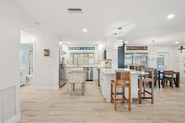 Dining room, Interior, Kitchen, Pendant Lights, Recessed Lighting, Stainless Steel Appliances, Wood Texture Flooring