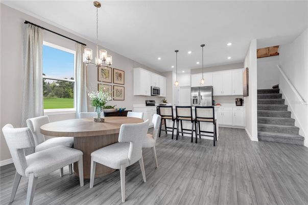 Chandelier, Dining room, Interior, Kitchen, Pendant Lights, Recessed Lighting, Stainless Steel Appliances, Wood Texture Flooring