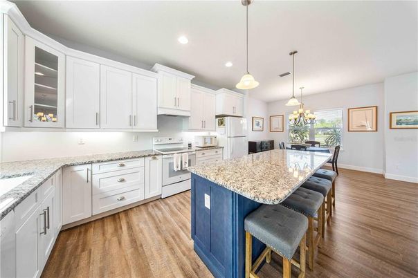 Dining room, Interior, Kitchen, Pendant Lights, Recessed Lighting, Stainless Steel Appliances, Wood Texture Flooring
