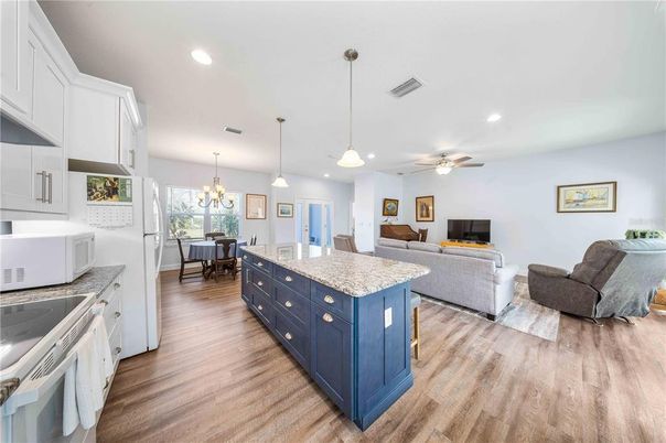 Chandelier, Dining room, Interior, Kitchen, Living room, Pendant Lights, Recessed Lighting, Wood Texture Flooring