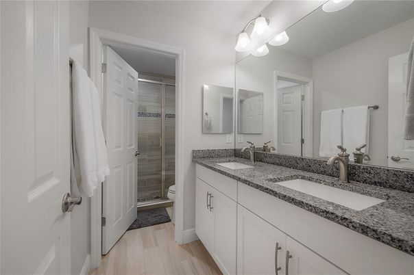 Bathroom, Dual Sink Vanities, Glass Shower, Interior, Wood Texture Flooring
