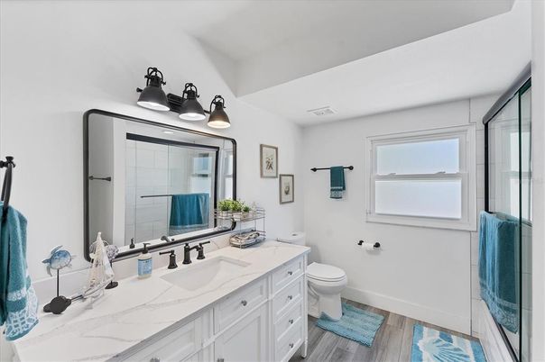 Bathroom, Dual Sink Vanities, Glass Shower, Interior, Wood Texture Flooring