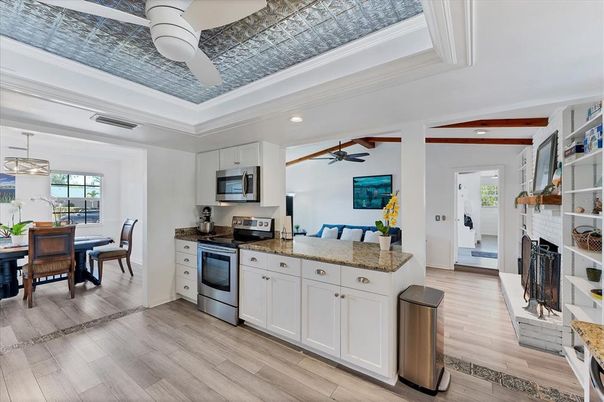 Dining room, Fireplace, Interior, Kitchen, Pendant Lights, Recessed Lighting, Wood Texture Flooring