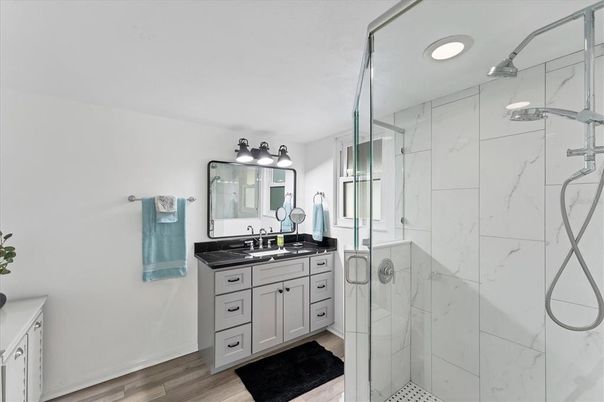 Bathroom, Glass Shower, Interior, Marble Walls, Recessed Lighting, Wood Texture Flooring