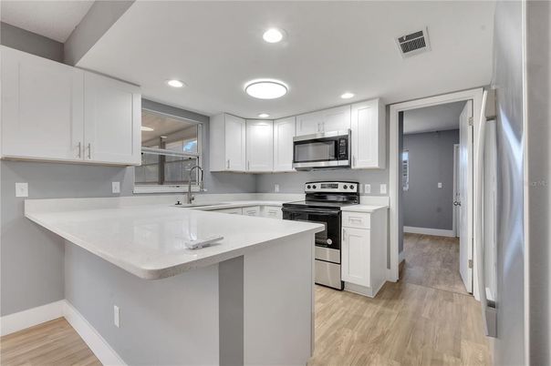 Interior, Kitchen, Recessed Lighting, Stainless Steel Appliances, Wood Texture Flooring