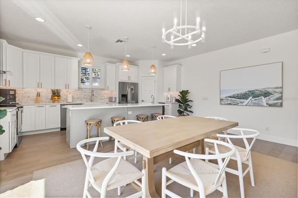 Dining room, Interior, Kitchen, Pendant Lights, Recessed Lighting, Stainless Steel Appliances, Wood Texture Flooring