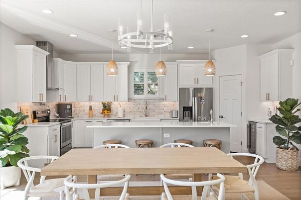 Dining room, Interior, Kitchen, Pendant Lights, Recessed Lighting, Stainless Steel Appliances, Wood Texture Flooring