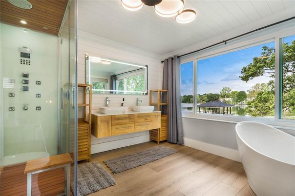 Bathroom, Free Standing Baths, Glass Shower, Interior, Recessed Lighting, Wood Texture Flooring