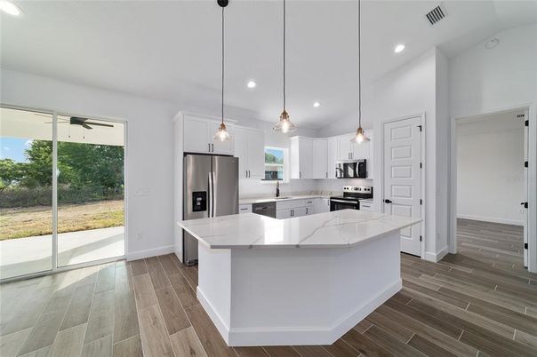 Interior, Kitchen, Pendant Lights, Recessed Lighting, Stainless Steel Appliances, Wood Texture Flooring